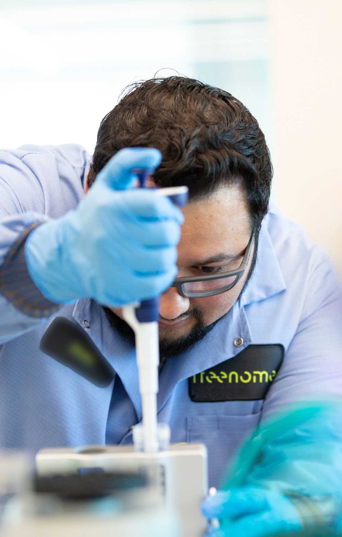 A Freenome clinician working in a Freenome lab where outpacing cancer starts with early detection