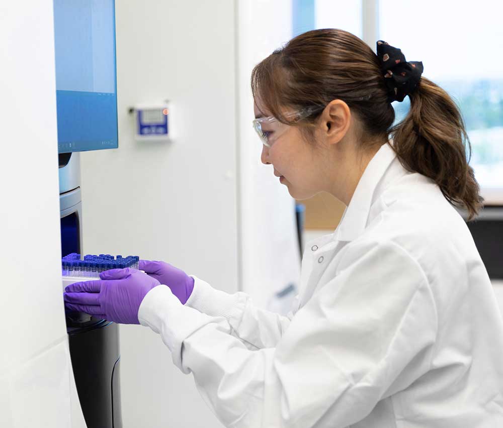 A Freenome clinician working in a lab